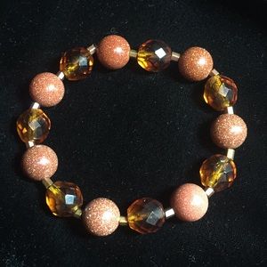 Bracelet. Goldstone, Swarovski amber crystals
